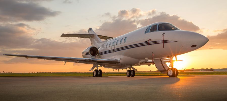 Private jet at sunset